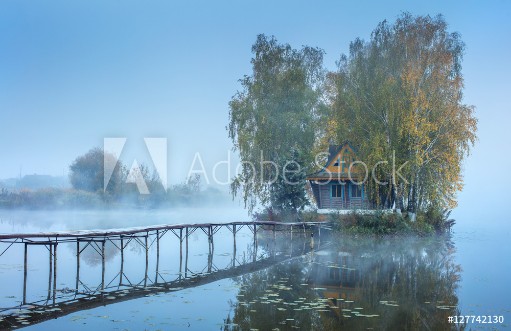 Picture of Blue foggy morning with embankment to fishing house